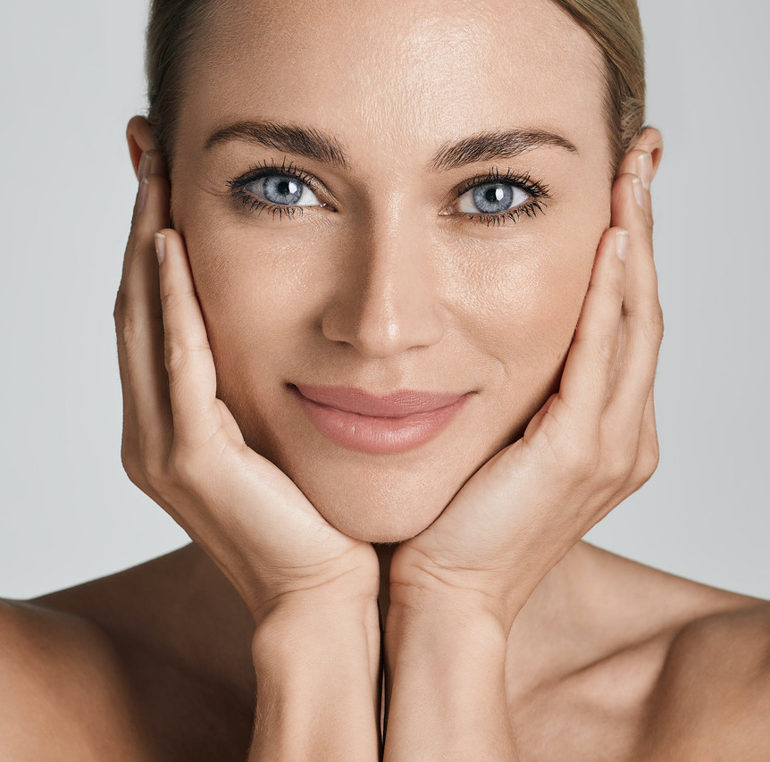 Photo of a woman with great skin after skin revitalization treatments