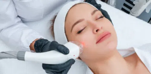 Woman receiving professional spa facial treatment