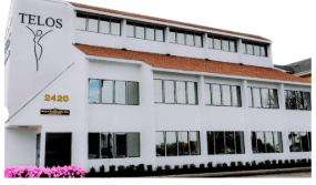White office building with TELOS sign